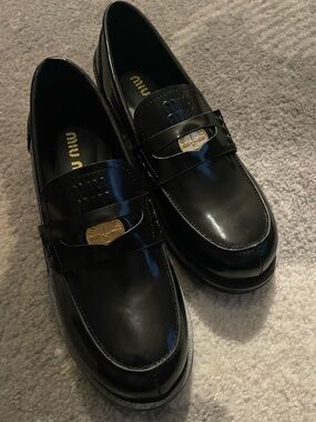 Miu Miu Black Patent Leather Loafers with Gold Plaque